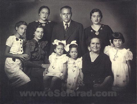 bouena_2 Family Portrait, 1937. L to R, standing: Marie (Miriam, older sister of Bouena), Eliahu (older brother), Rachel (older sister); seated: Regina (younger sister), Bouena, Henrietta (daughter of Marie), Alice (daughter of Marie), Simha (Bouna's mother), Daisy (Desica, daughter of Rachel). Institution: Dr. Eli Garfinkle