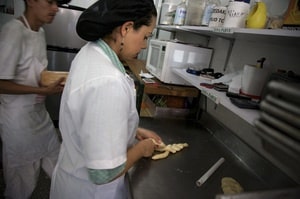 Galit Zapata, a member of the Jewish community in Bello, prepares bread in the family's kosher bakery.