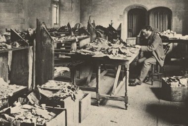 Solomon Schecter examining manuscripts from the Cairo Geniza.(Cambridge University Library)