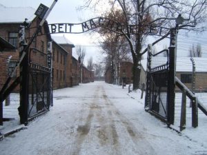 The entrance to the Auschwitz concentration camp, pictured here. A former guard at the Auschwitz death camp will go on trial on at least 300,000 counts of accessory to murder. Photo: Wikimedia Commons.