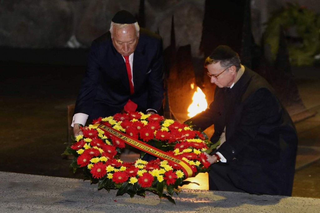 Spanish Foreign Minister Jose Manuel Garcia-Margallo (L) lays a wreath at the Hall of Remembrance on Jan. 14, 2015, during his visit to the Yad Vashem Holocaust Memorial museum in Jerusalem that commemorates the six million Jews killed by the Nazis during World War II.