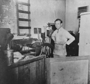 Printer Joseph Souriano working in his shop, Columbia Printing Co., on Seneca St., Seattle, Washington, 1923. Courtesy of University of Washington Special Collections.