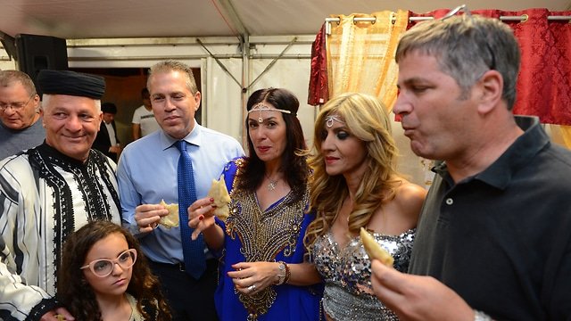 Public Security Minister Gilad Erdan and Culture Minister Miri Regev celebrate at the Sabah family home in Ashkelon (Photo: Avi Rokach)