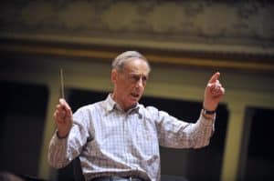 Former French minister and music conductor Lionel Stoleru conducts the European Romantic Orchestra on April 6, 2010 during a rehearsal at the Salle Gaveau in Paris. The orchestra will perform on April 6, 2010. AFP PHOTO LIONEL BONAVENTURE (Photo credit should read LIONEL BONAVENTURE/AFP/Getty Images)
